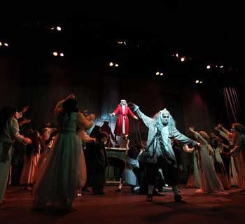Jacob Marley and the ensemble from A Christmas Carol