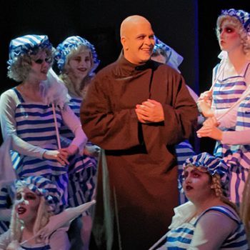 Uncle Fester and female ensemble at the Addams Family Musical