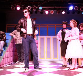 Danny Zuko and girls from the Grease Musical