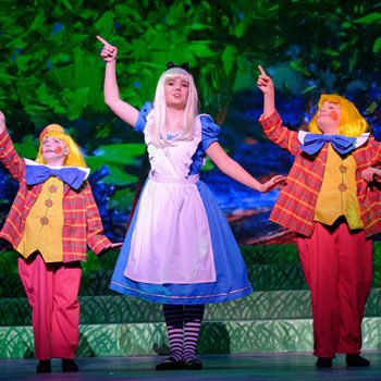 Alice dancing with Tweedle-dee and Tweedledum
