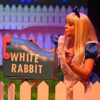 Alice beside the White Rabbit mail box