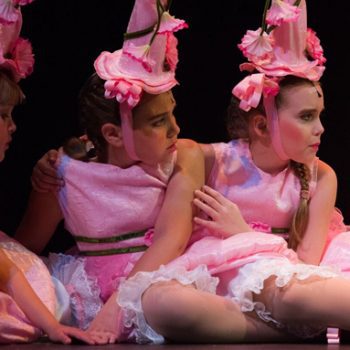 Young girls in pink for the Wizard of Oz Scarecrow performance