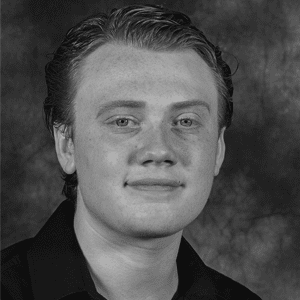A black and white photo of a young man.
