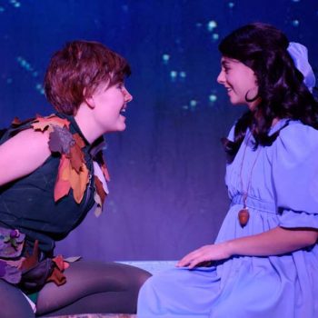 Wendy and Peter Pan talking and smiling together