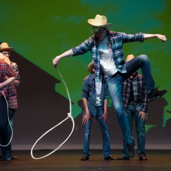 High Voltage performing as cowboys