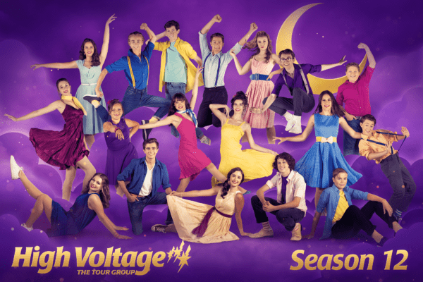 A group of people posing in front of a purple background with the words high voltage season 12.