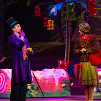 Whimsical candyland stage with two actors