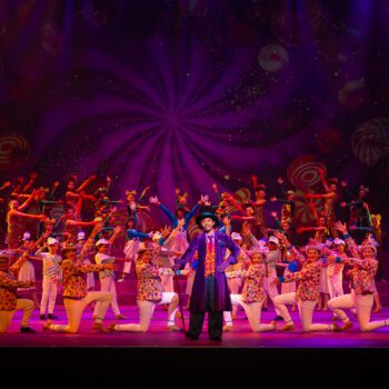 Vibrant stage musical ensemble with central lead