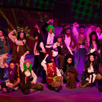 Group of costumed pirates striking poses